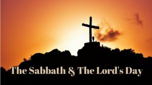 Silhouette of a cross on a hill at sunset representing the Sabbath and the Lord’s Day